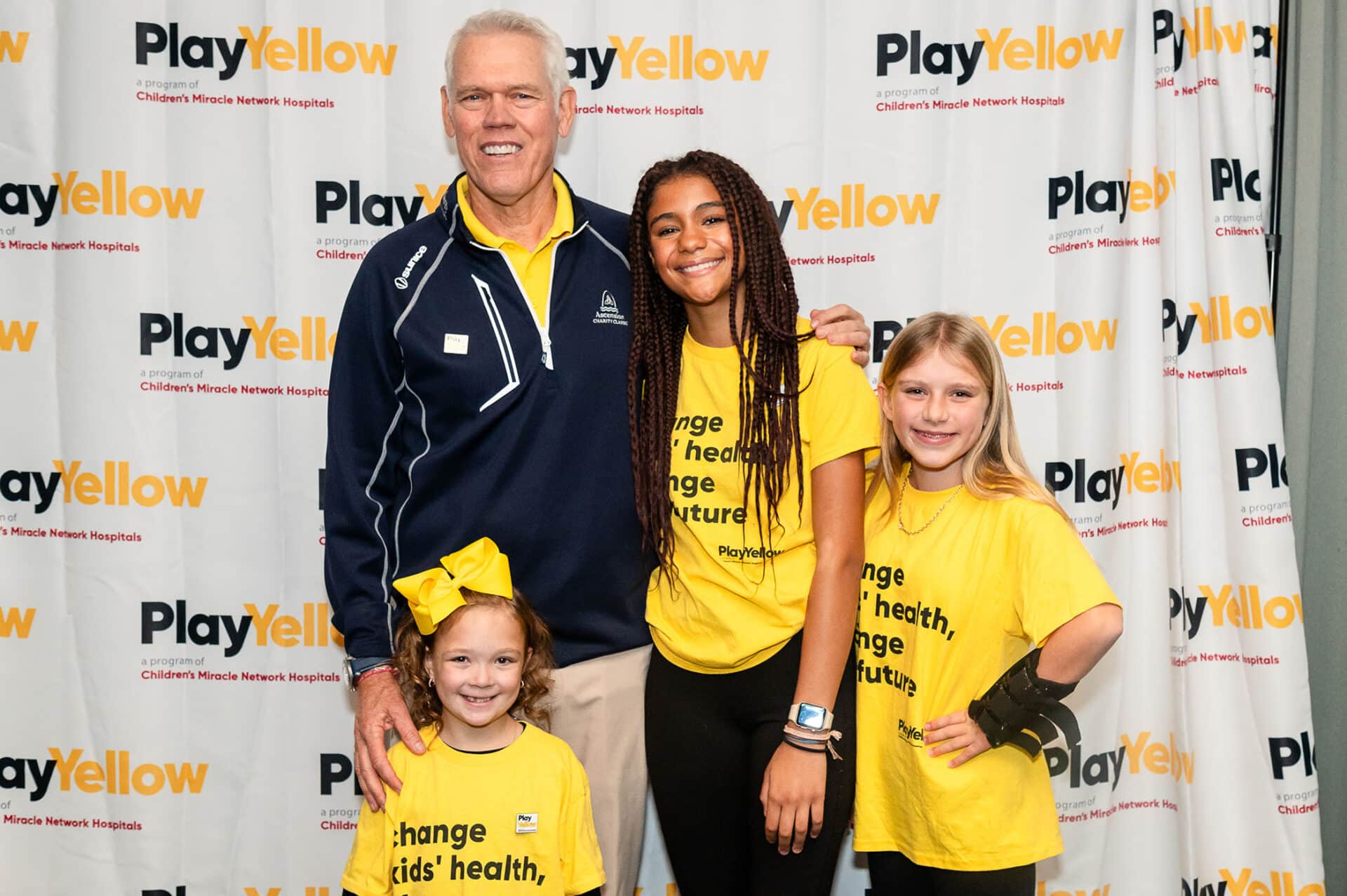 Jay Delsing pictured with Miracle Kids Zoey, Teagan & Lilly (2023)